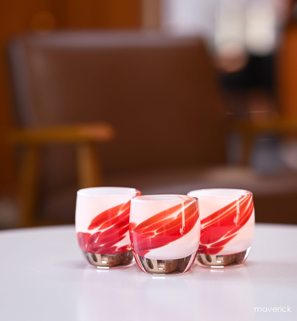 maverick white with red wing, hand-blown glass votive candle holders. 