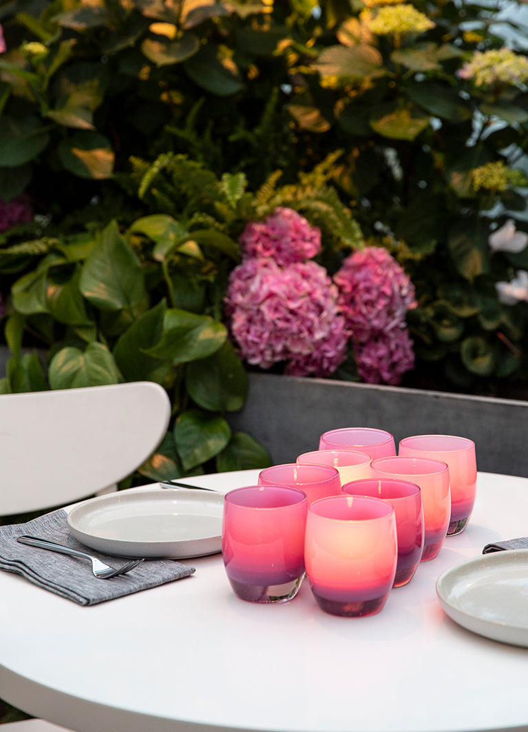 a grouping of 8 mom glassybaby on a brunch table - a purple hand-blown glass candle holder, the perfect way to celebrate mom