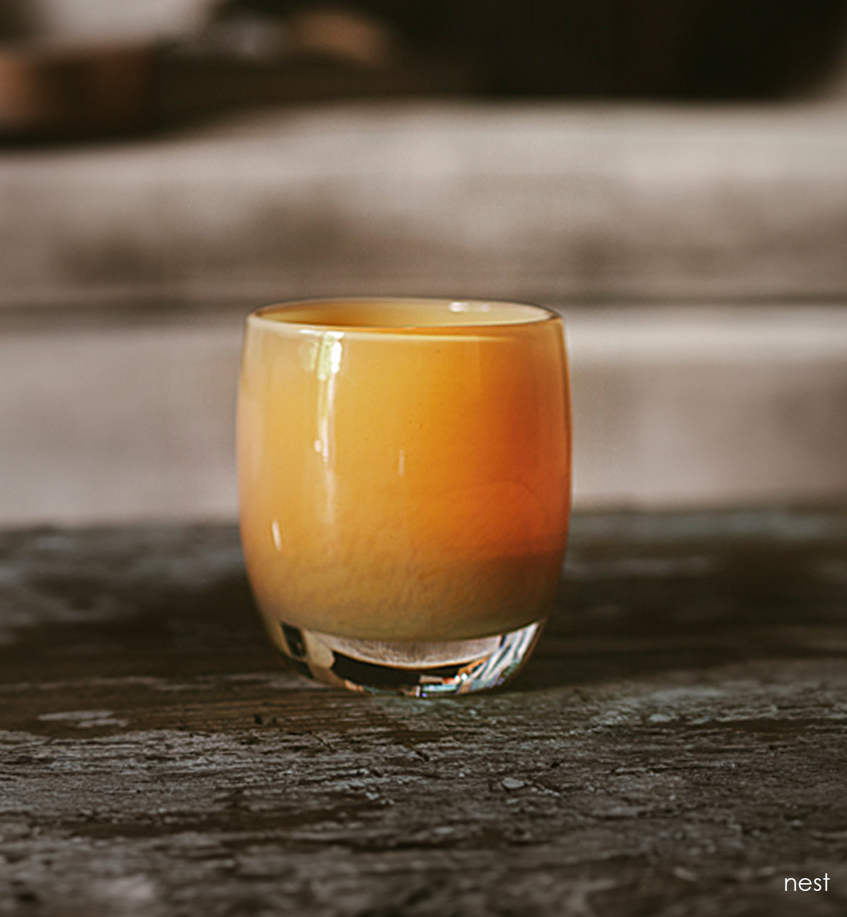 nest golden tan hand-blown glass votive candle holder. 