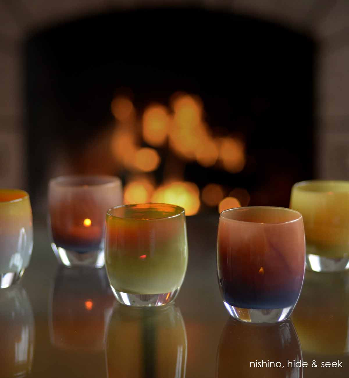 nishino, translucent purple brown hand-blown glass votive candle holder, paired with hide & seek