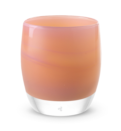 nurture is a warm peachy hand-blown glass votive candle holder