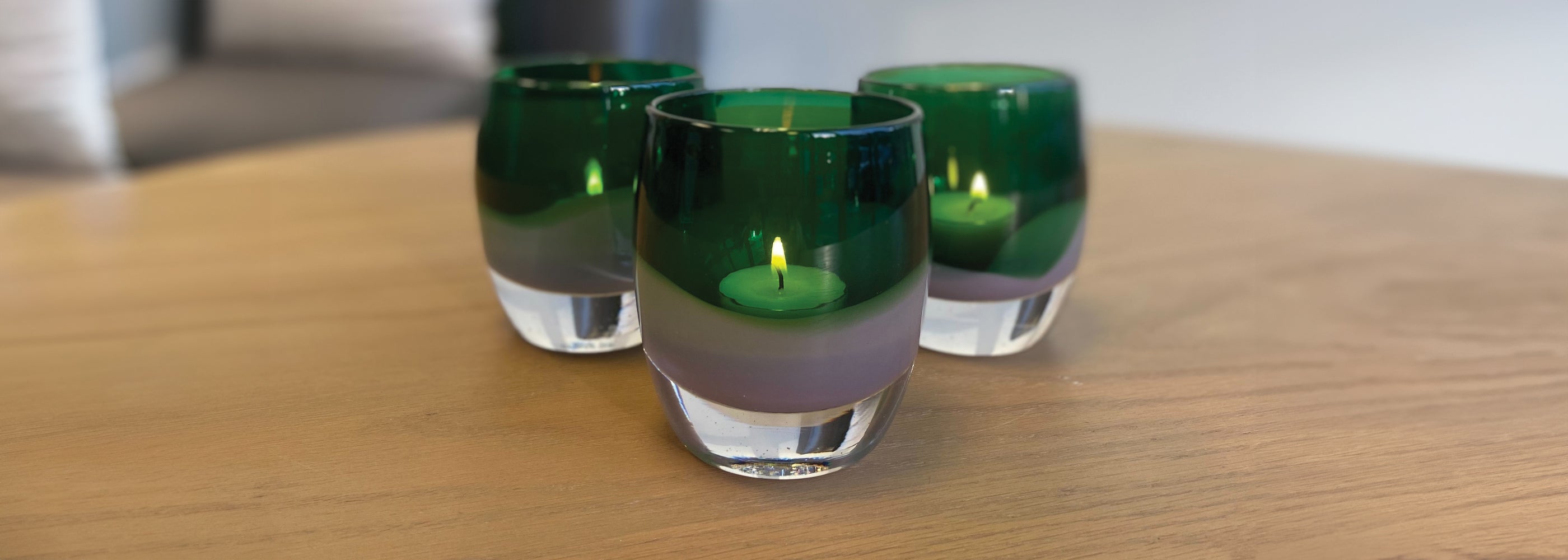 three one of a kindess green and purple glassybaby hand-blown glass candle holder