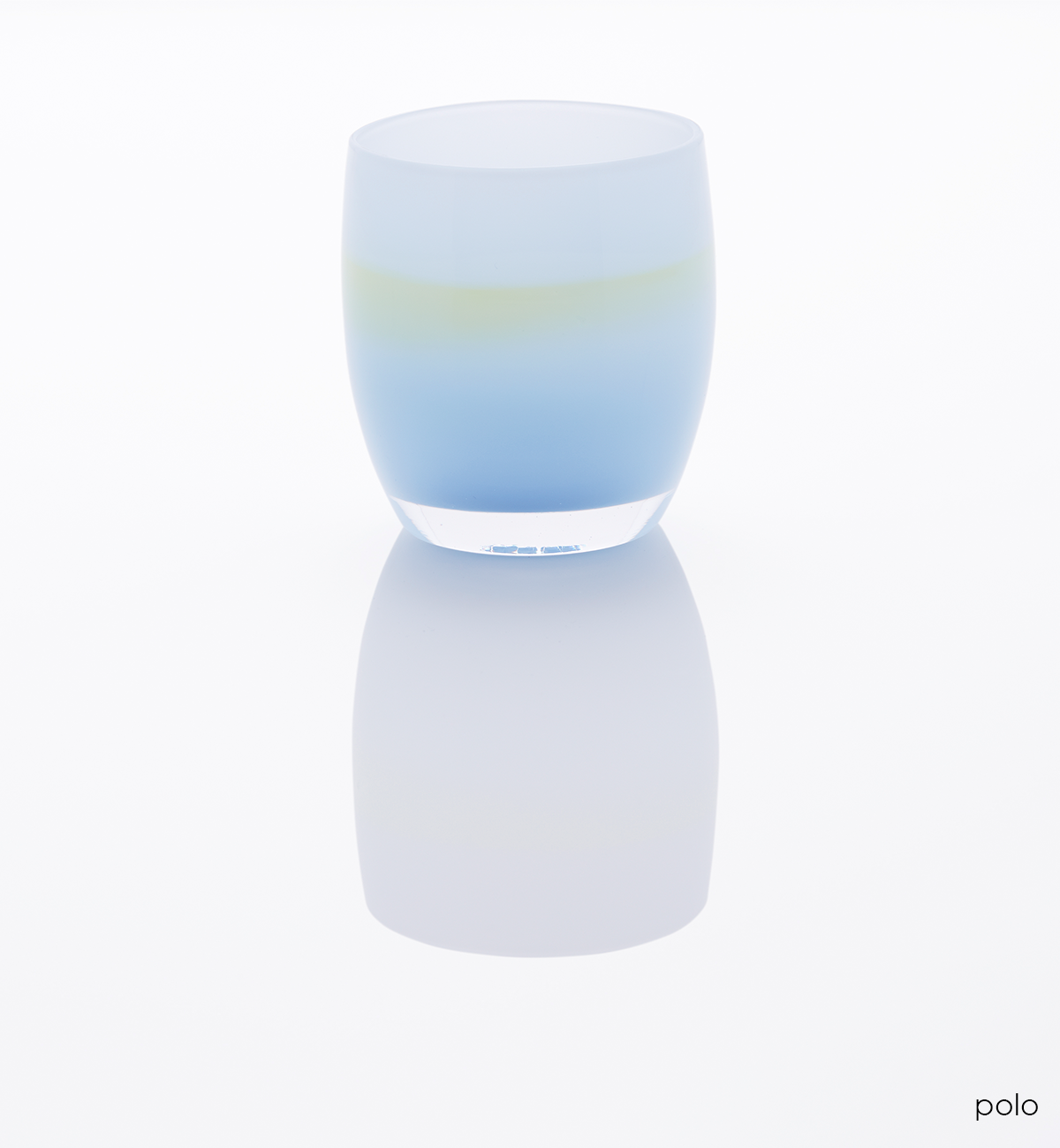 polo light blue with yellow band in the center hand-blown glass votive candle holder on a white reflective surface.