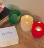 opening of the evie tealight box with ice, ice, baby on wood dresser with evie white box next to them.