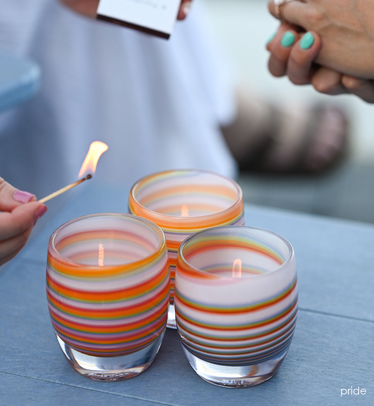 pride rainbow swirled, hand-blown glass votive candle holder.