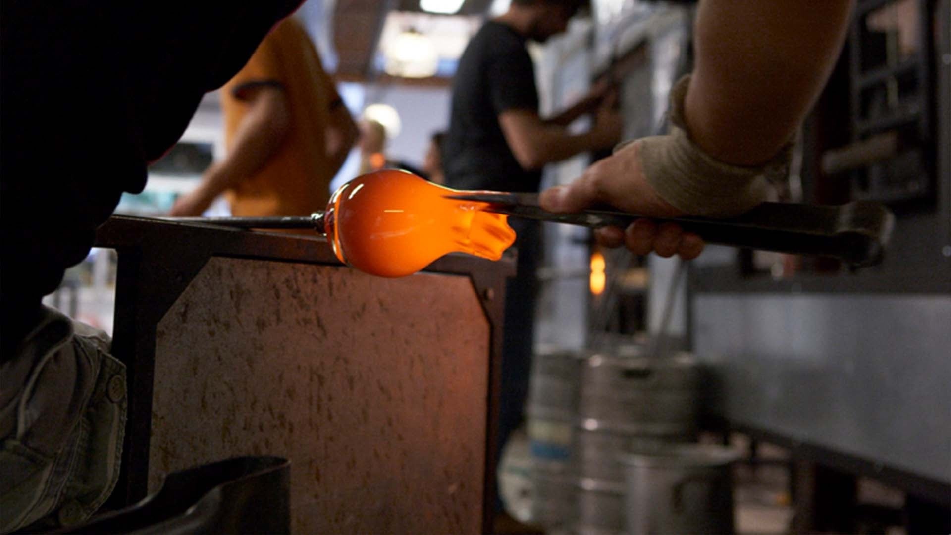 pulling hot glass, crafting hand-blown glass votive candle holders