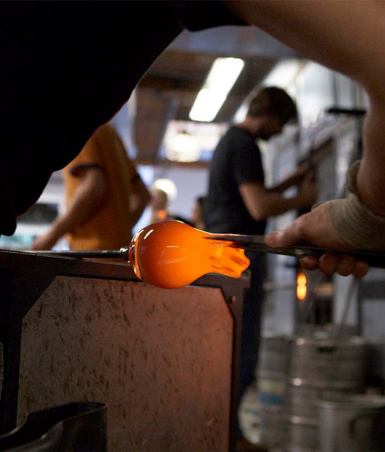 pulling hot glass, crafting hand-blown glass votive candle holders