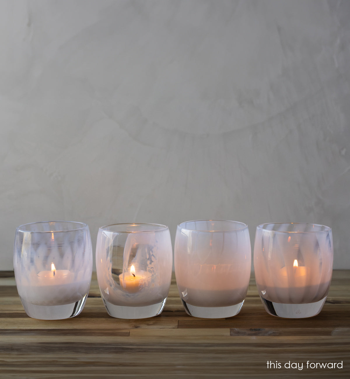 'this day forward' wedding gift set four different patterns of gentle white lit on wood table. 