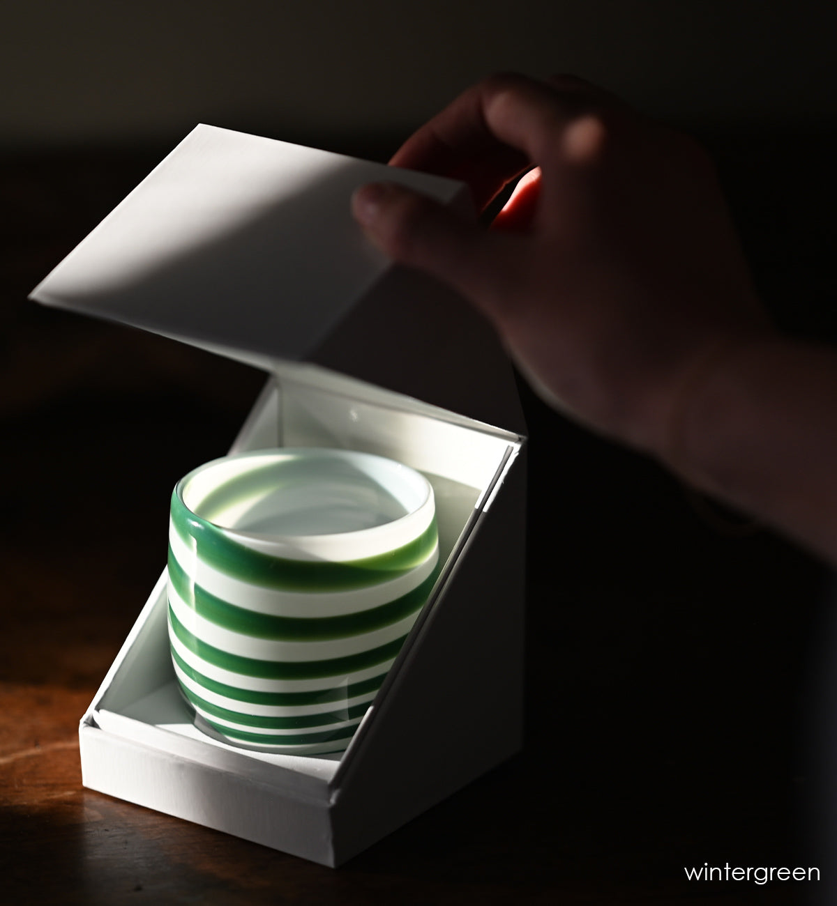 green stripes on a white base create beautiful wintergreen, a hand-blown glass votive candle holder.