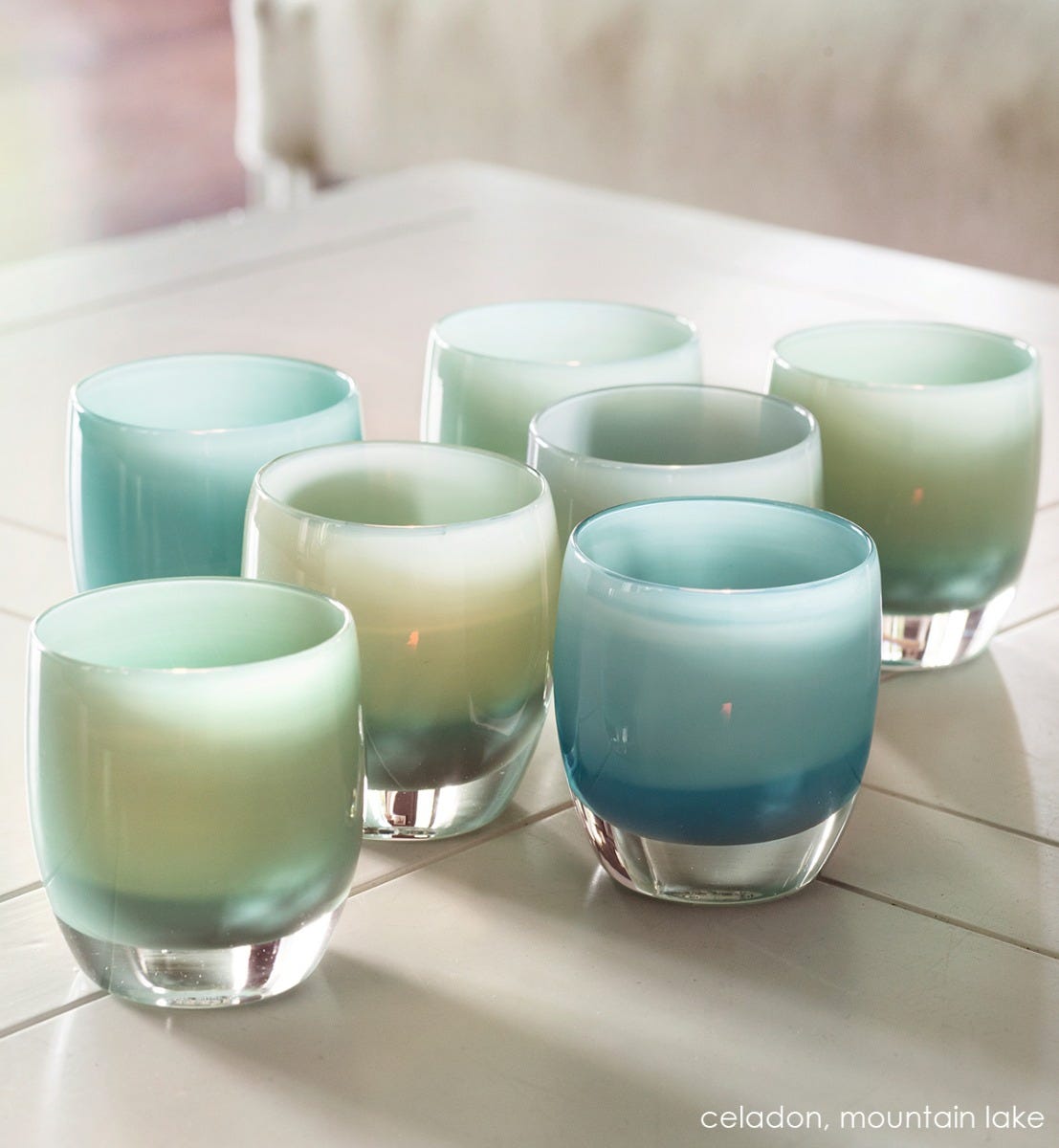 celadon wedgewood gray hand-blown glass votive candle holder. Paired with mountain lake.