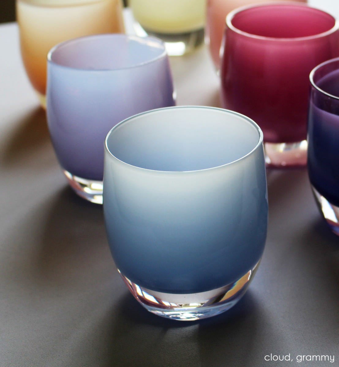 cloud light periwinkle hand-blown glass votive candle holder. Paired with grammy.