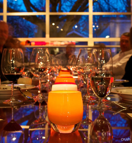 crush bright orange hand-blown glass votive candle holder