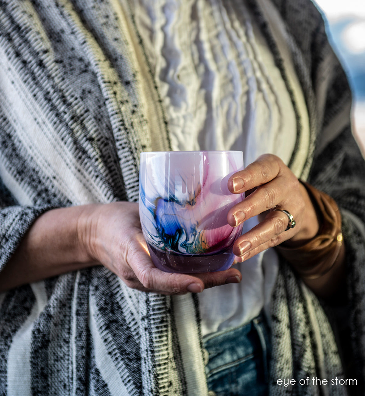 eye of the storm, multicolor texture moving through light lavender, hand-blown glass votive candle holder