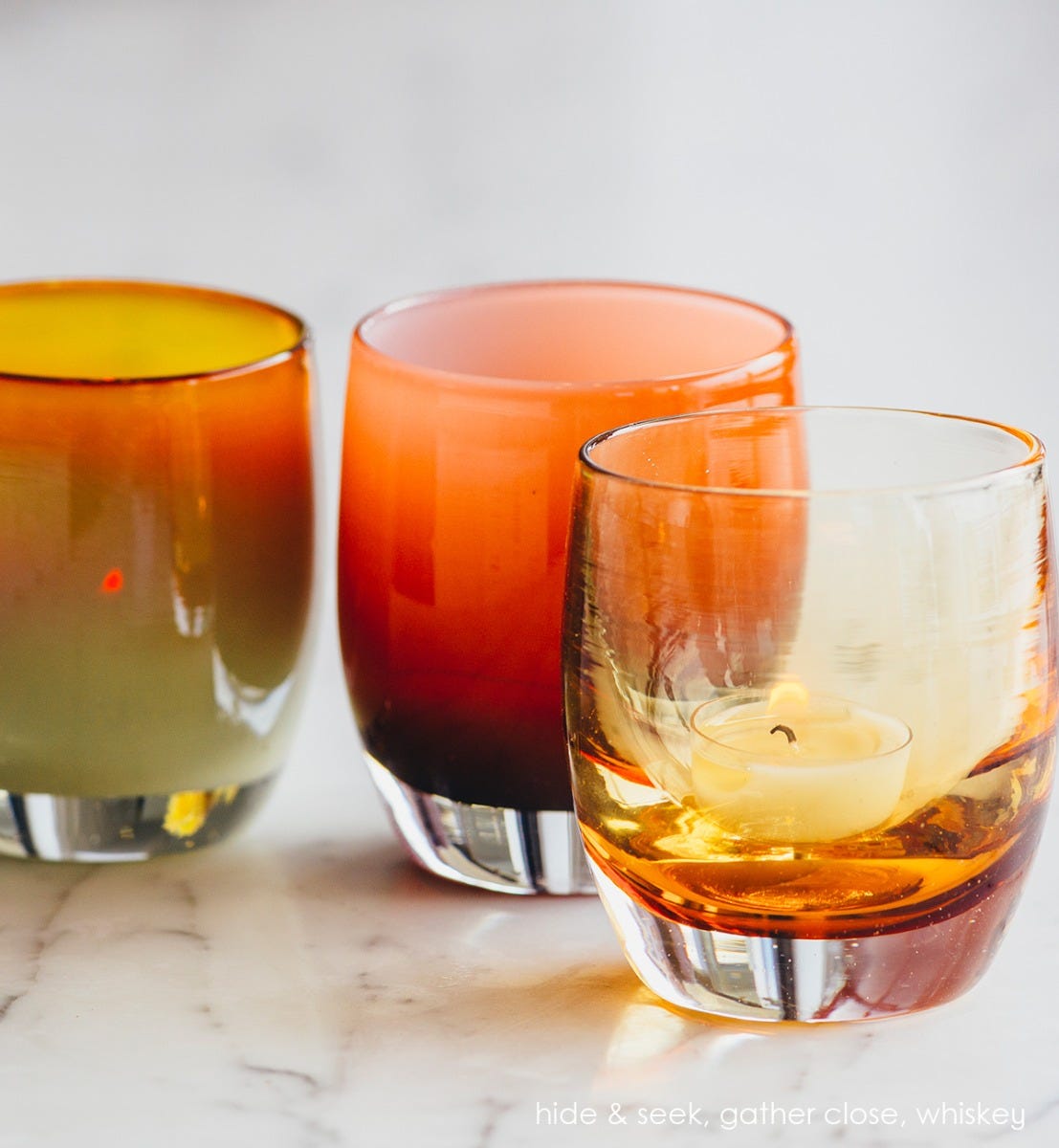 gather close, opaque amber, hand-blown glass votive candle holder. Paired with hide and seek and whiskey.