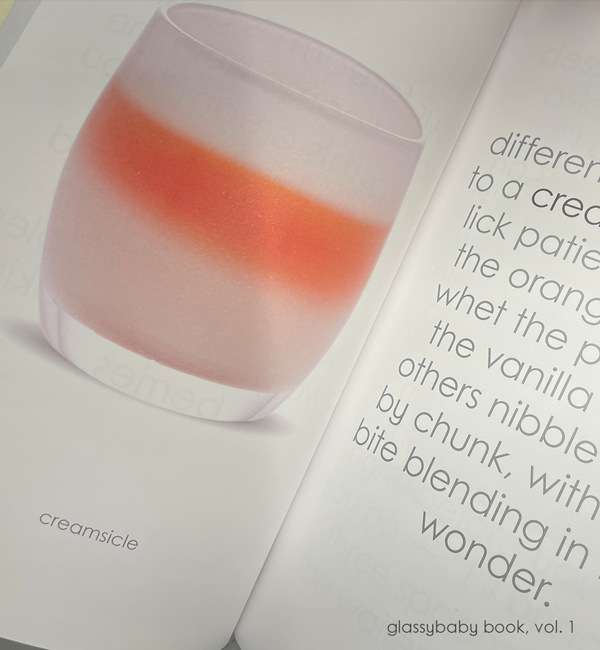coffee table book of glassybaby volume one, opened on creamsicle page.