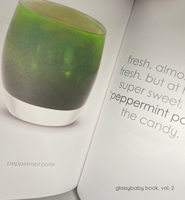 coffee table book of glassybaby volume two, opened on peppermint pattie page.