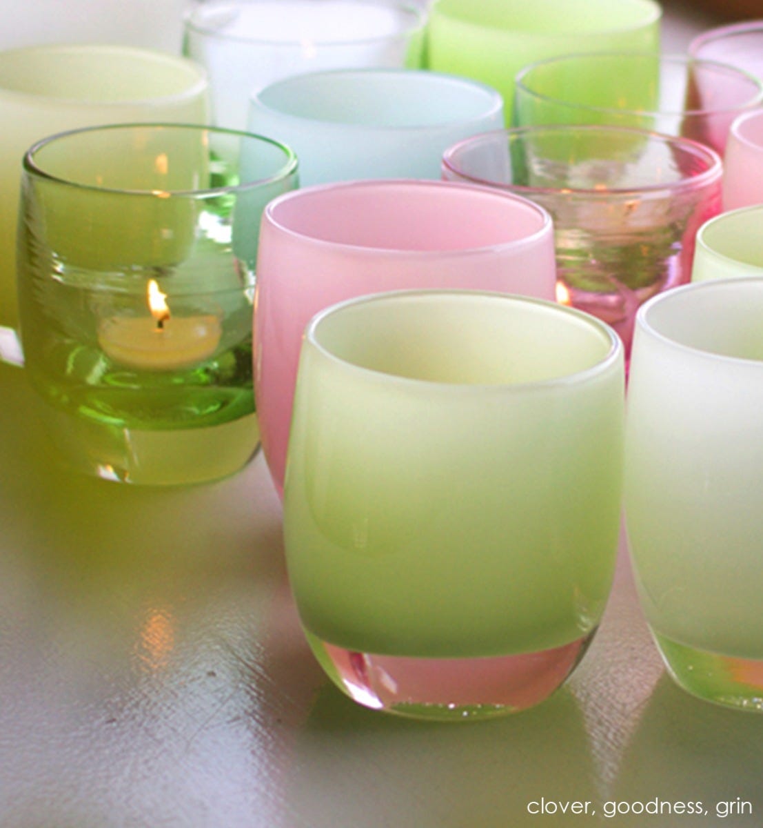 grin soft light green hand-blown glass votive candle holder. Paired with clover and goodness.