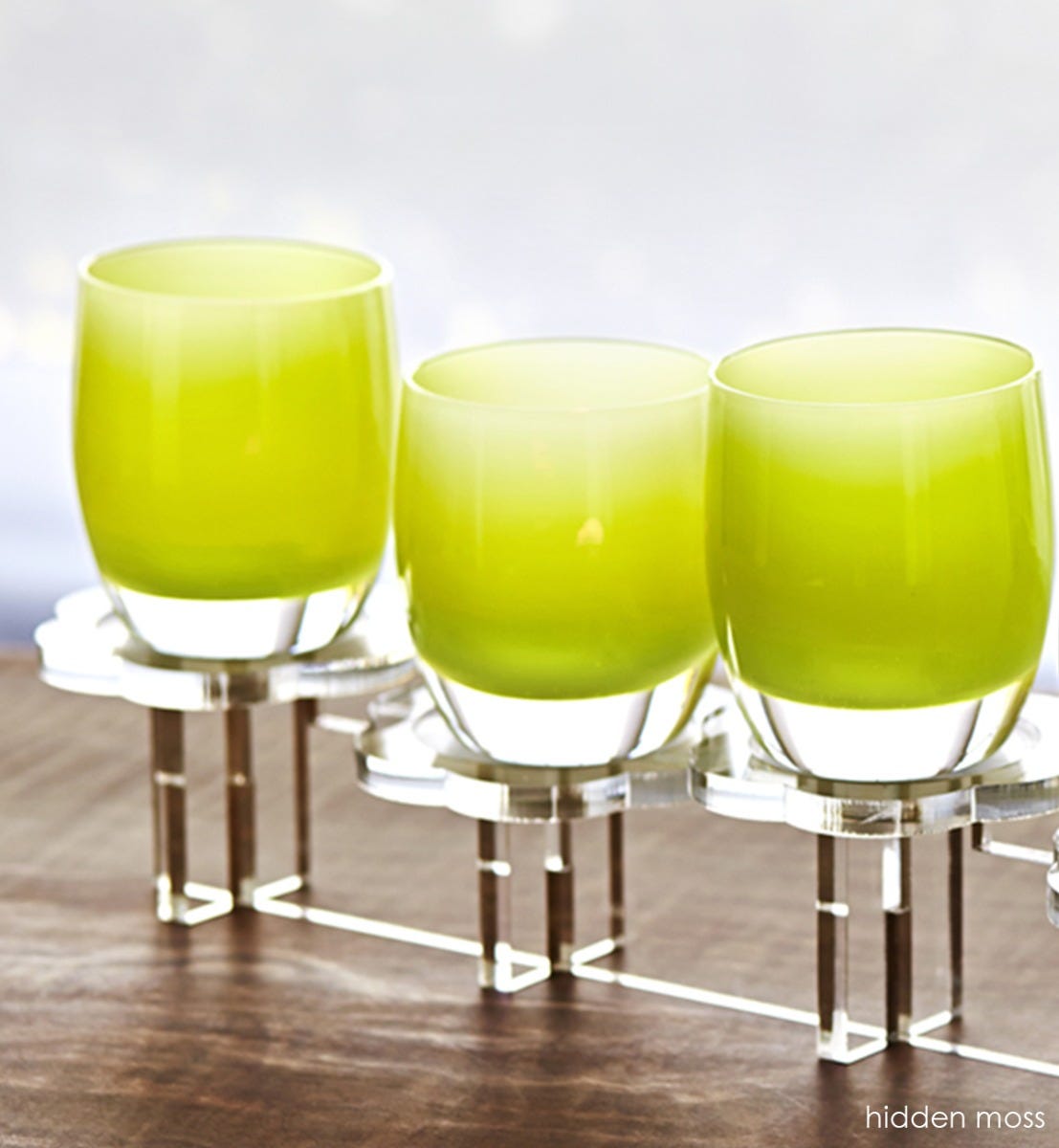 hand-blown pear green glass votive candle holder.