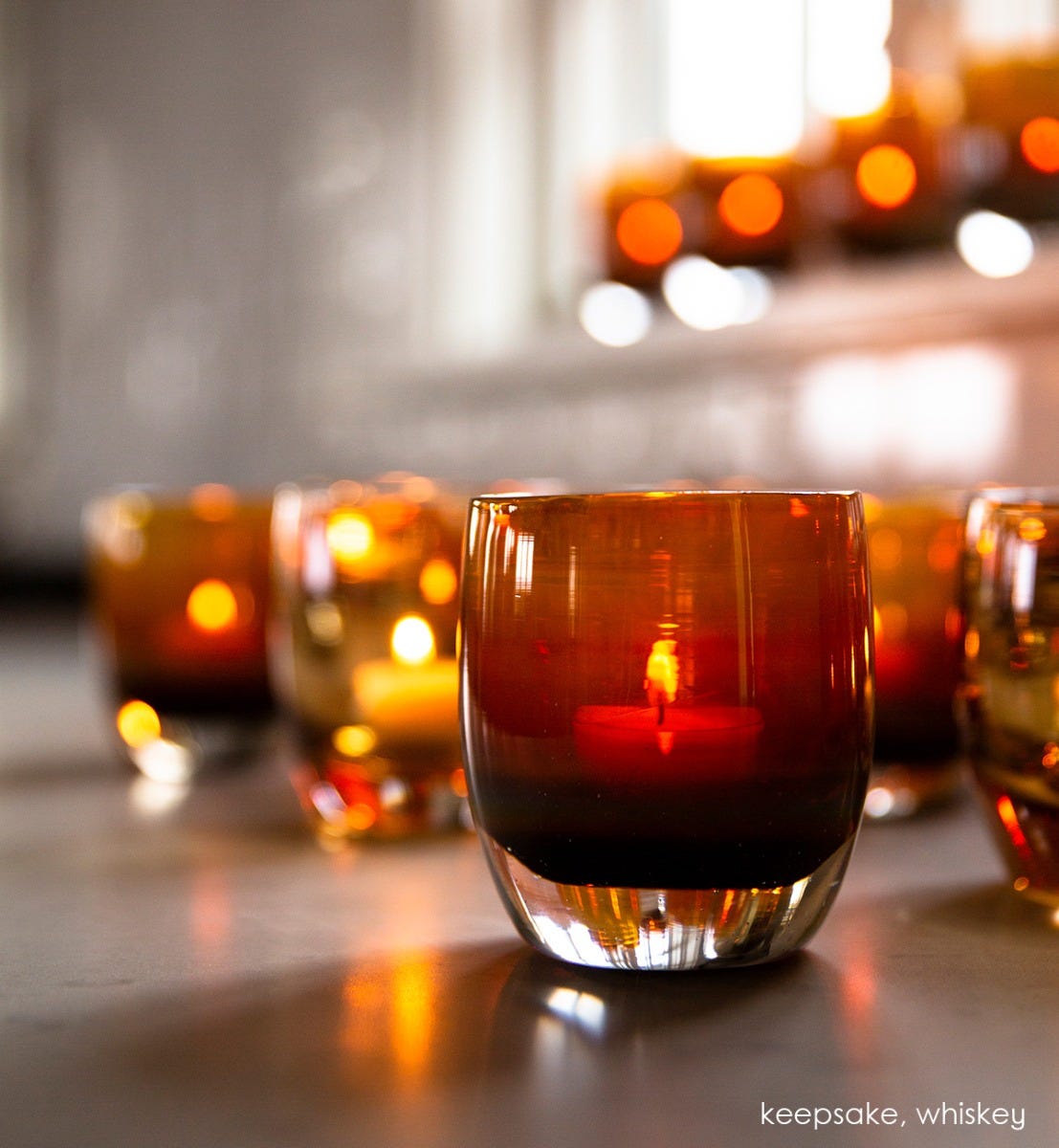 keeepsake golden amber with gold metallic interior hand-blown glass votive candle holder. Paired with whiskey.