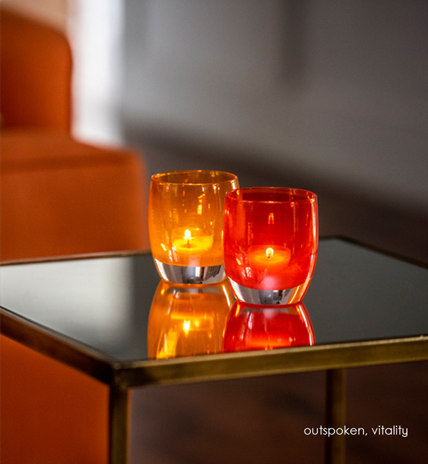 outspoken, translucent orange, hand-blown glass votive candle holder