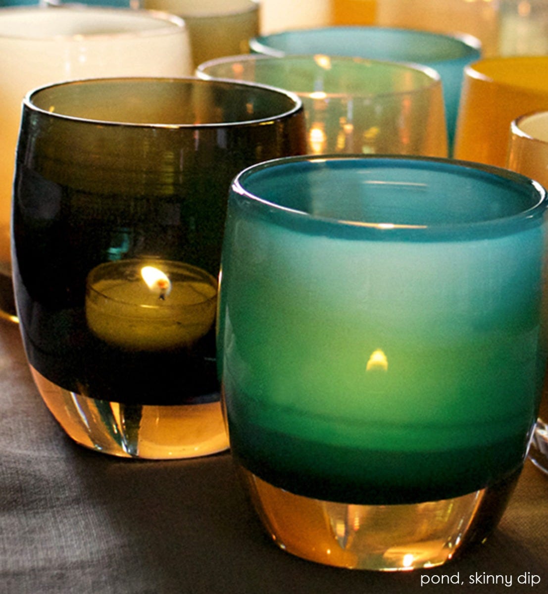 pond transparent dark evergreen hand-blown glass votive candle holder. Paired with skinny dip.