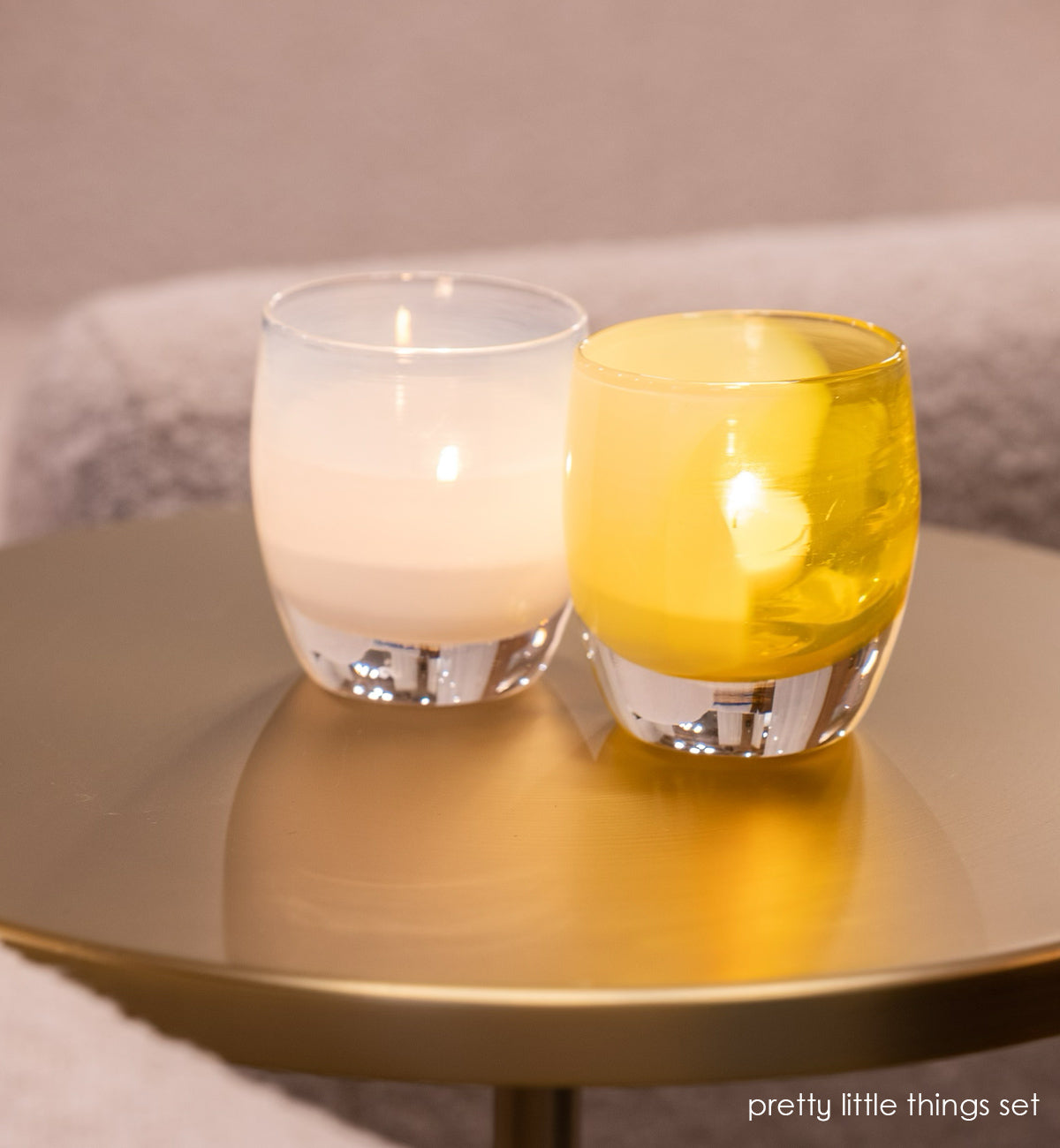 soft white dream and bright yellow just because come together to create a beautiful 2-piece hand-blown candle holder set.