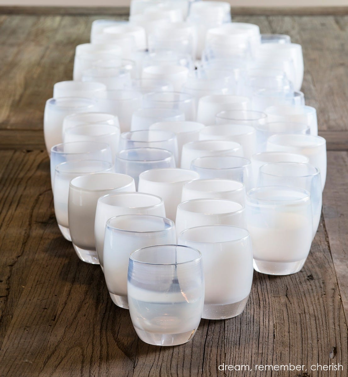remember soft white hand-blown glass votive candle holder. Paired with dream and cherish.