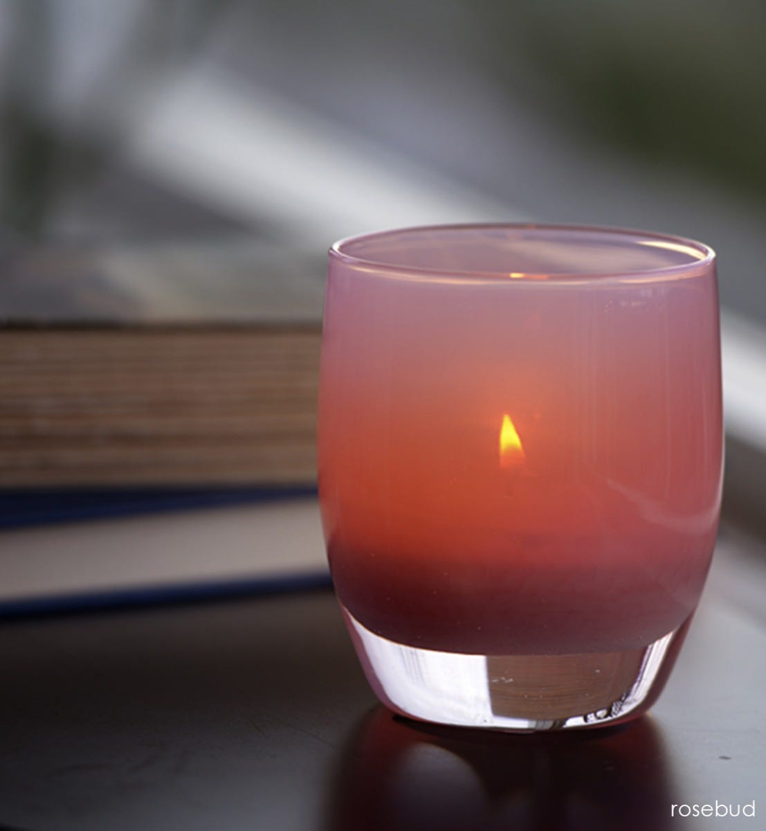 hand-blown rosewood glass votive candle holder.