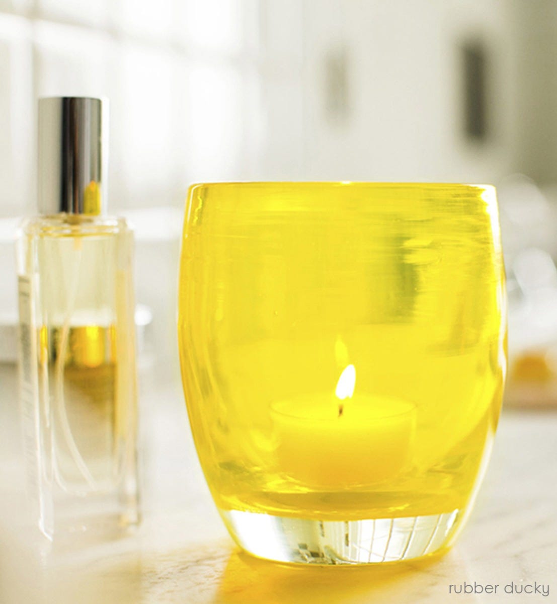 hand-blown clear yellow glass votive candle holder