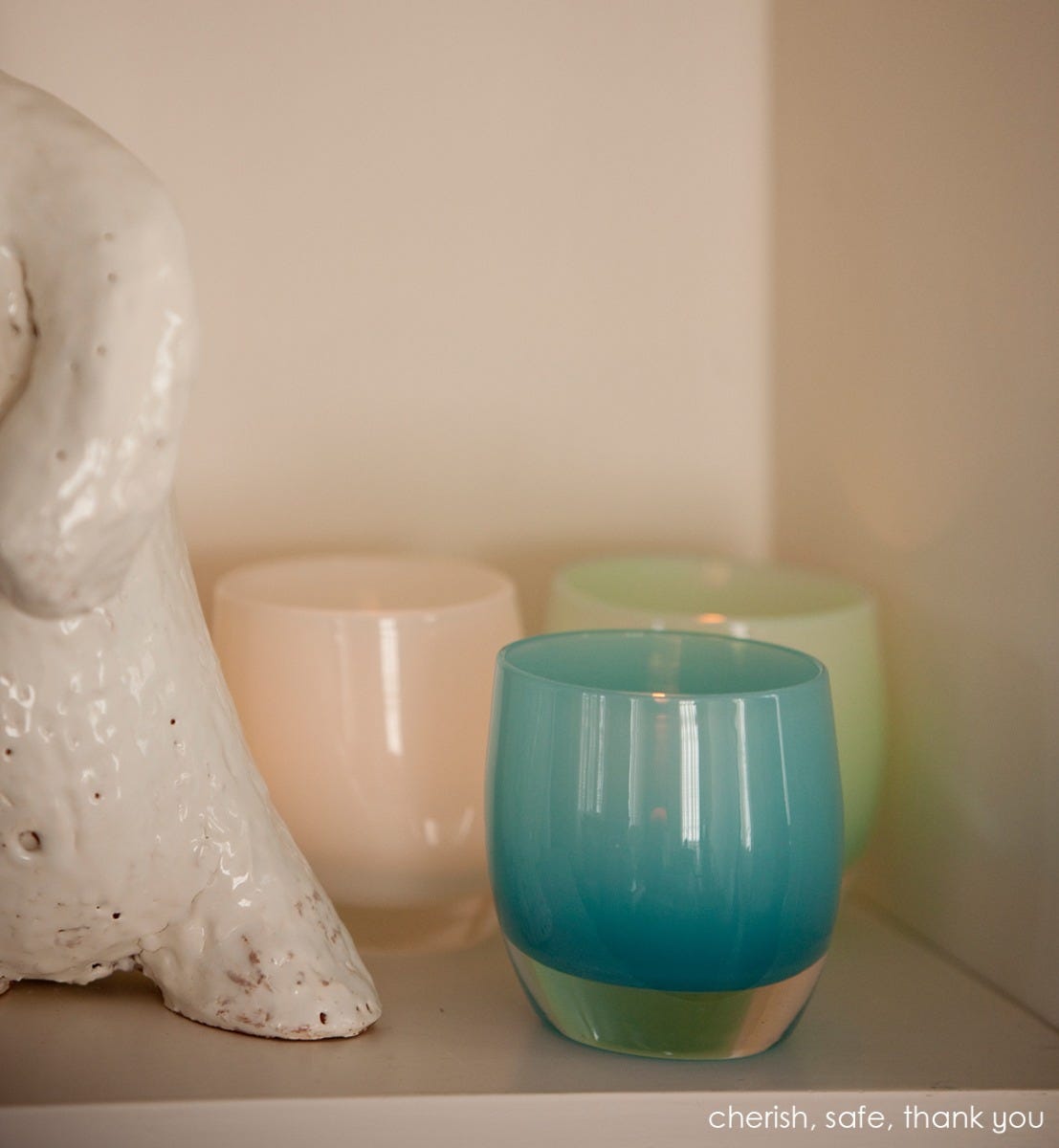 safe bright teal blue hand-blown glass votive candle holder. Paired with cherish and thank you.