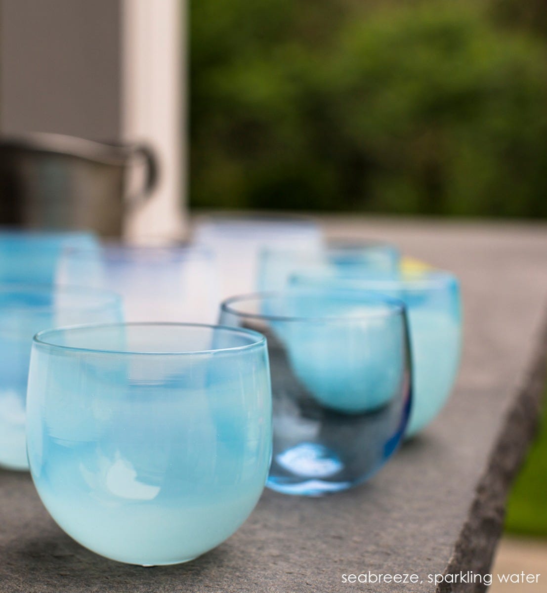 hand-blown light blue drinking glass.