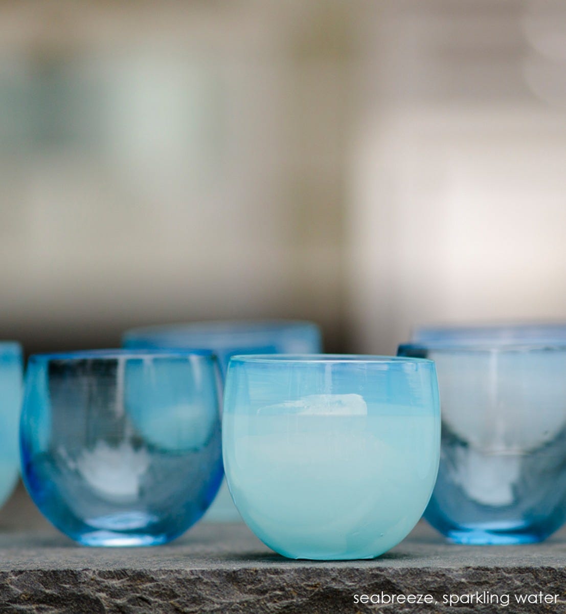 hand-blown light blue drinking glass.