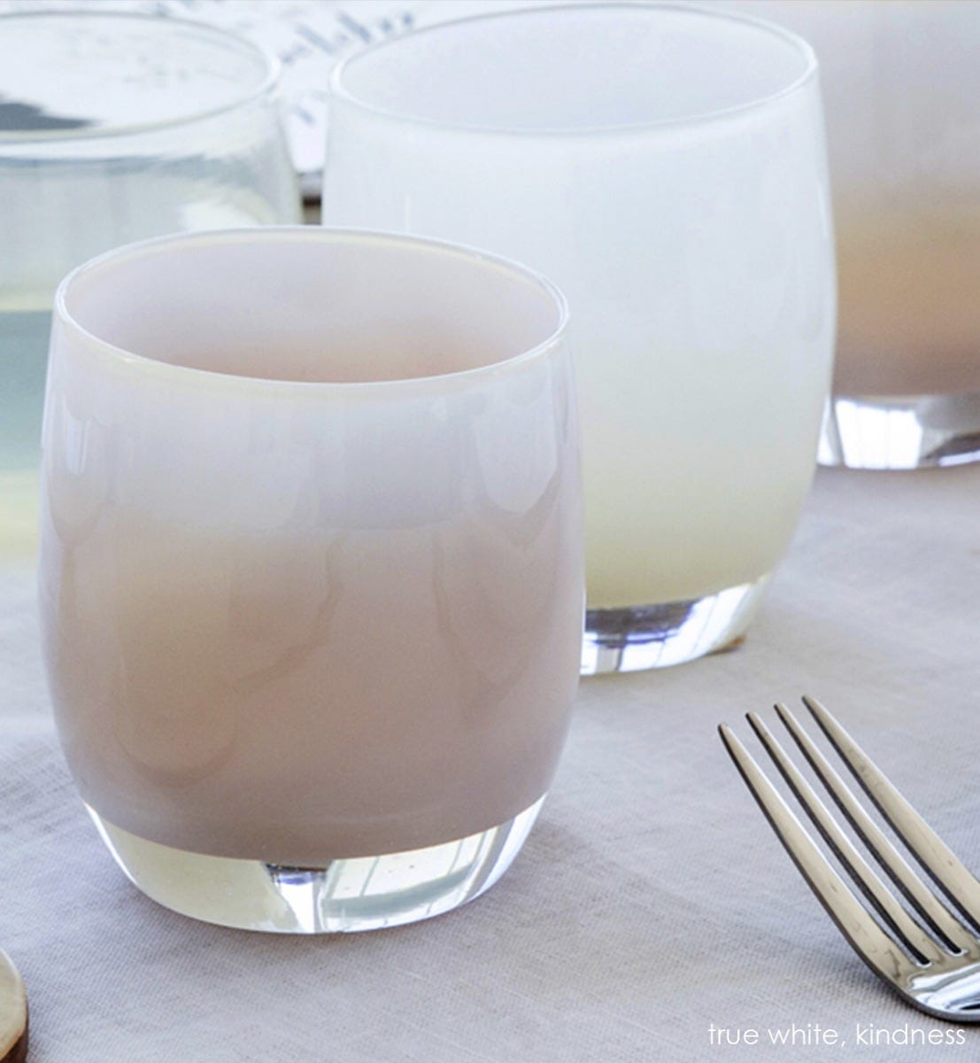 true white, opaque pinky white, hand-blown glass votive candle holder. Paired with kindness.