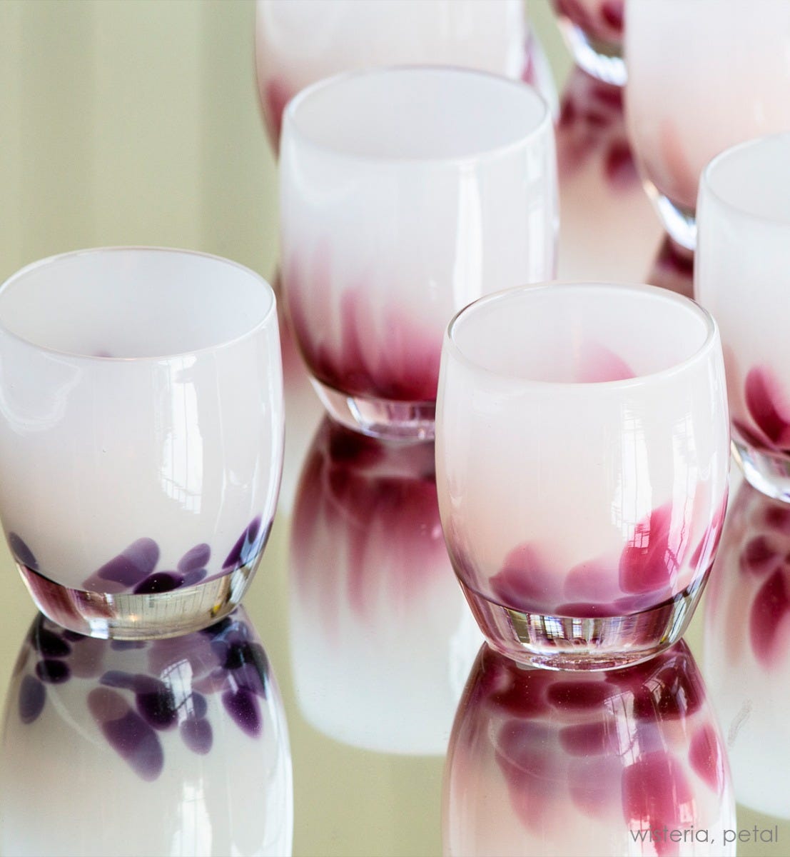 wisteria, white with purple petals emerging from the bottom, hand-blown glass votive candle holder, paired with petal